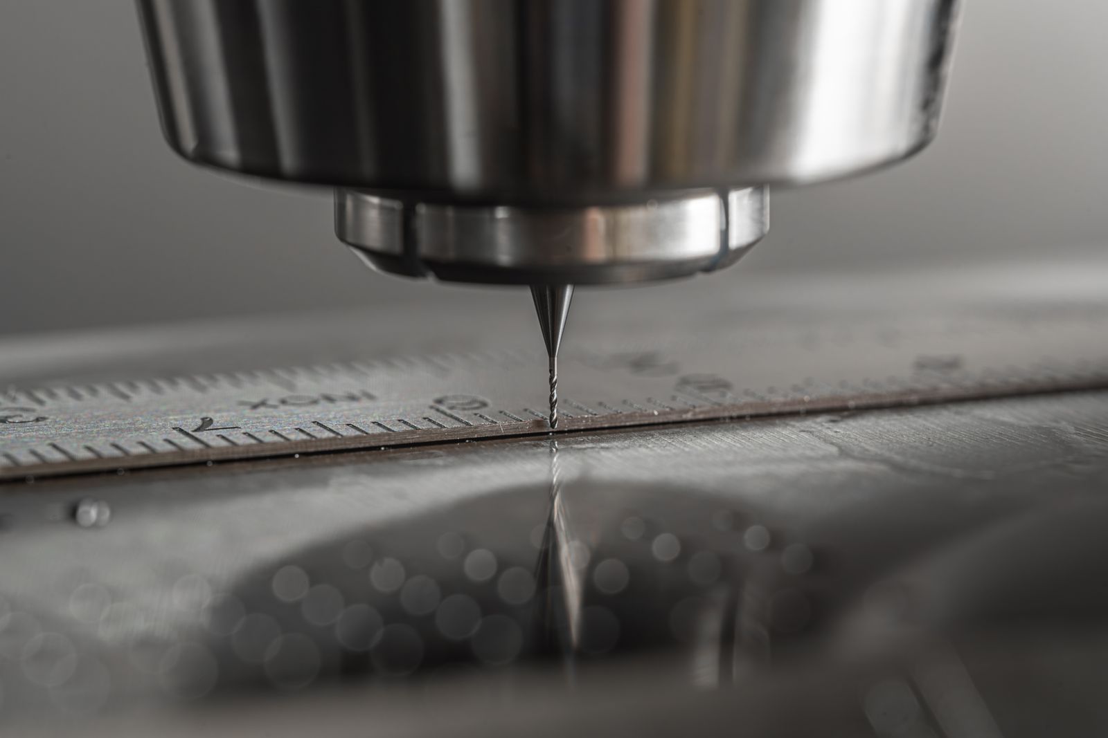 A CNC machine tool cutting a precise feature into a metal workpiece